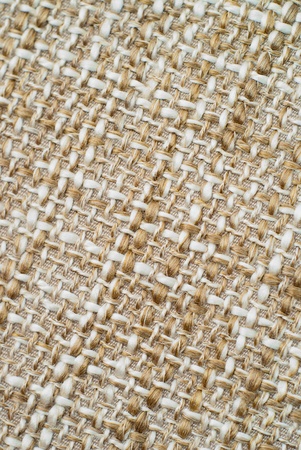 large woven linen background in yellow-brown