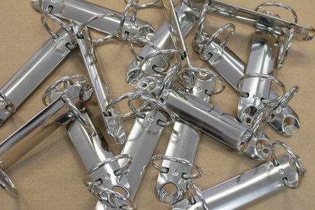 metal holder rings for sheets on a brown paper