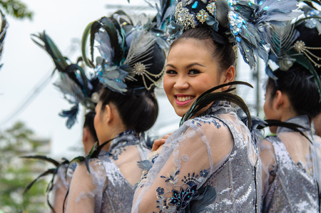 CHIANG MAI, THAILAND - FEBRUARY 02, 2013: Traditionally dressed woman in procession on Chiang Mai 37th Flower Festival paradeのeditorial素材