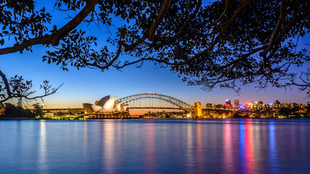 SYDNEY â AUGUST 31, 2014: Opera House and Harbour Bridge at sunset, Royal Botanic Gardenのeditorial素材