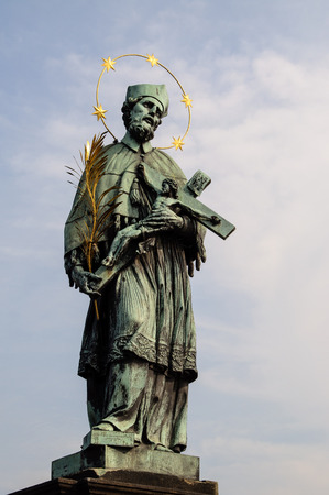 holy statue of John of Nepomuk on the Charles Bridge in Prague, Czech Republicの写真素材