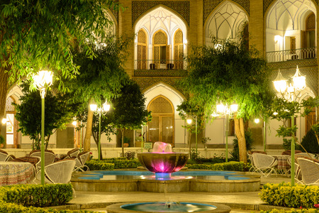 ISFAHAN, IRAN - APRIL 25, 2015: Illuminated Garden of Hotel Abbasi, ancient caravanseraiのeditorial素材