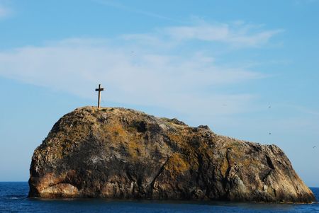 crucifix on a rock in  the Black seaの写真素材