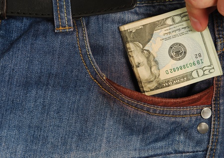 American money is in the pocket of blue jeansの写真素材