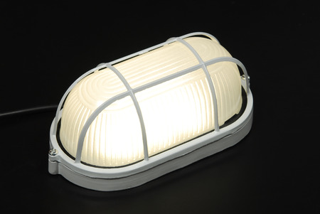 Glowing lamp isolated on the black background