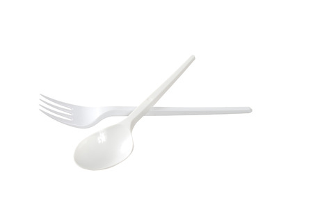 plastic disposable fork and spoon is isolated on a white backgroundの写真素材