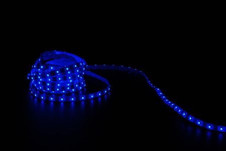 Blue led strip on the black backgroundの写真素材