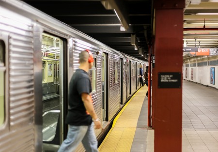 Passengers getting out of a Subway in New York Cityのeditorial素材