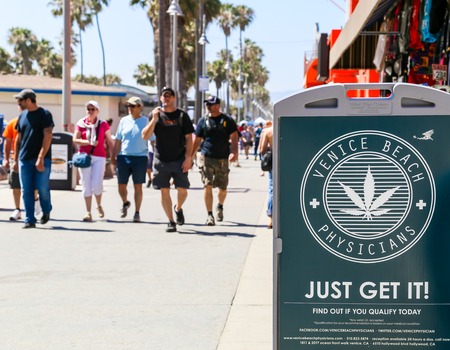 A display on Venice Beach boardwalk showing advertising for Physicians.のeditorial素材