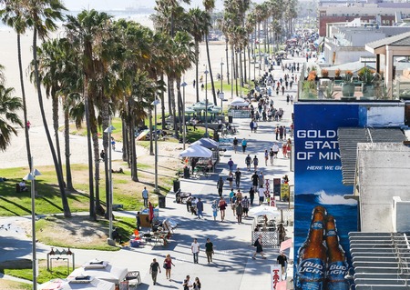 The Venice Beach Boardwalk with stalls and people.のeditorial素材