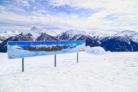 Sign explaining the summits of the mountain panorama at Mutegg piste in the Schwemmalm ski area in South Tyrol.のeditorial素材