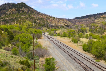 Railroad tracks in mountainous landscape near East Raton in New Mexico, USA.の写真素材