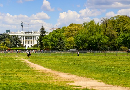 Looking towards the White House in Washington DC from the Ellipse with a lot of people walking around.のeditorial素材