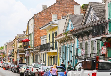 New Orleans, USA - May 14, 2015: Colorful historic buildings on Bourbon Street in French Quarter, many of them with balconies.のeditorial素材