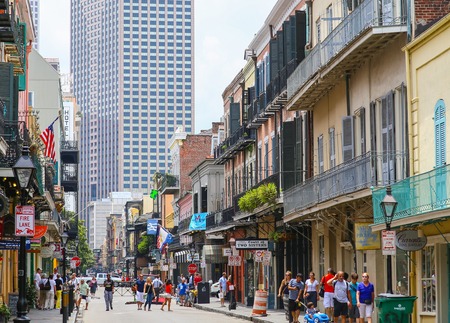 New Orleans, USA - May 14, 2015: View of Royal Street in French Quarter with its historic architecture, in the back modern highrises. Many people are strolling down the street.のeditorial素材