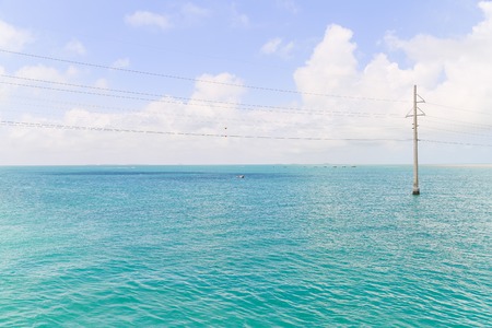 A Power Pole in the shallow water in the Florida Keys, USA.の写真素材