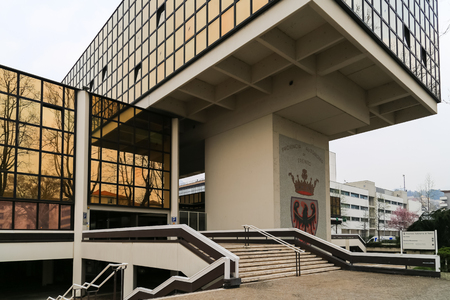 Trento, Italy - March 21, 2017: Modernist administrative building of the Autonomous Province of Trento with the emblem of the province and a glass facade.のeditorial素材