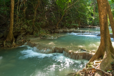 Water fall in spring season located in deep rain forest jungle,Thailandの写真素材