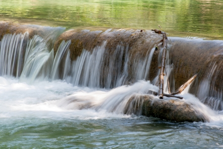 Water fall in spring season located in deep rain forest jungleの写真素材