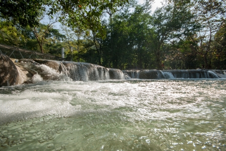 Water fall in spring season located in deep rain forest jungleの写真素材