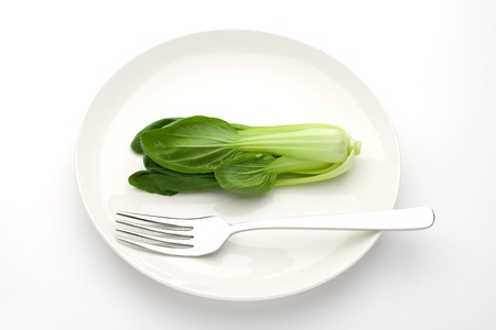 Chinese cabbage on a white plateの写真素材