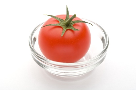Ripe red tomato of the white backの写真素材