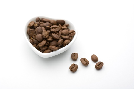 A plate and coffee beans of white heartの写真素材