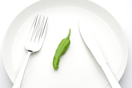 green pepper of a white backgroundの写真素材