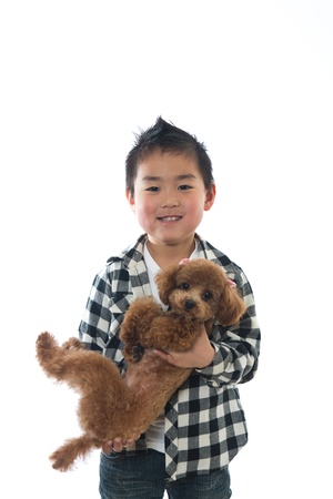 The child who holds a dogの写真素材