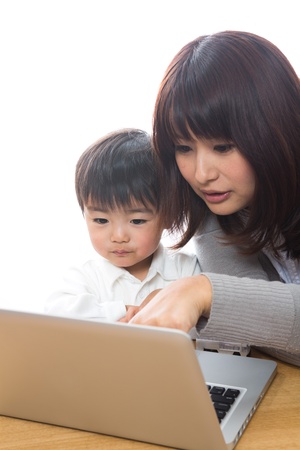 Parent and child who watch a computerの写真素材