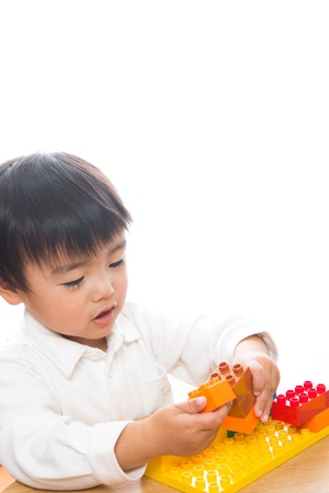 The child who plays in Legoの写真素材