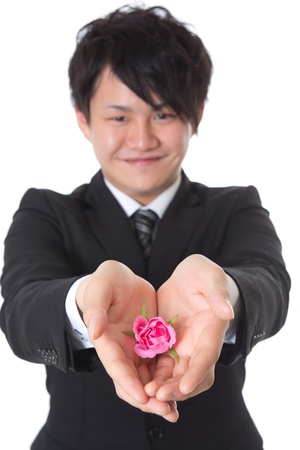 The young businessman who holds out a presentの写真素材