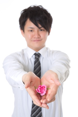 The young businessman who holds out a presentの写真素材