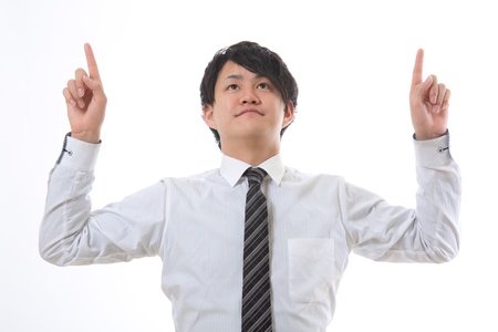 The young businessman who points to the topの写真素材