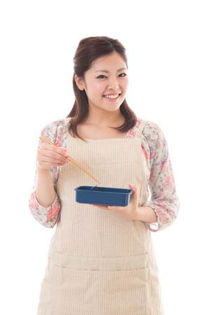 The young woman who cooks a lunchの写真素材