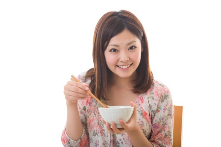 The young woman who eatsの写真素材