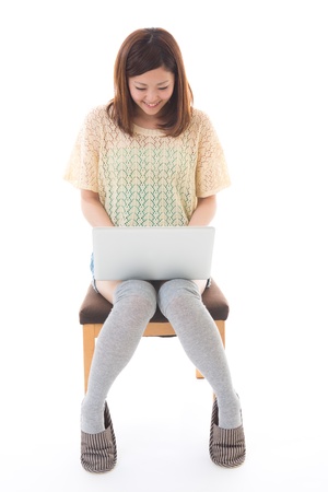 Young woman to see a computerの写真素材