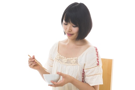 The young woman who eatsの写真素材