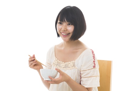 The young woman who eatsの写真素材