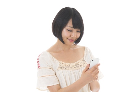 Young woman to see a smartphoneの写真素材