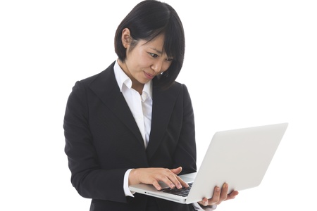Young businesswoman to see a computerの写真素材