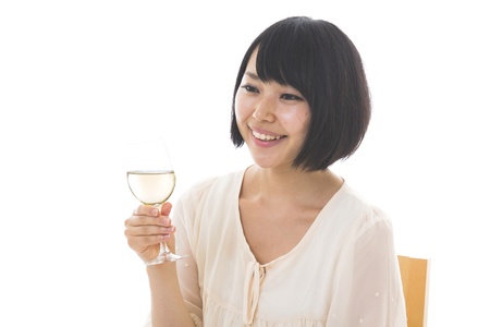 The young woman who drinks wineの写真素材