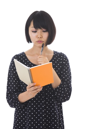 Woman with a memo as a notebookの写真素材