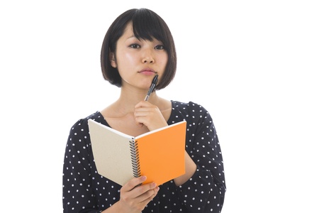 Woman with a memo as a notebookの写真素材