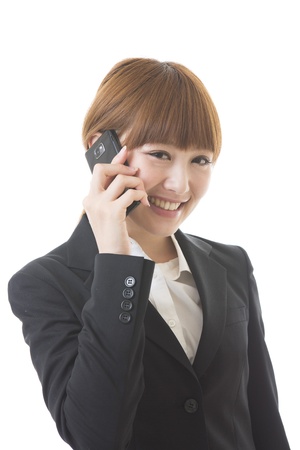 The Young businesswoman who talks on the telephoneの写真素材