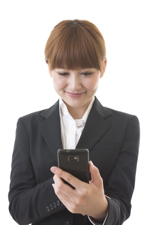 Young businesswoman to see a smartphoneの写真素材