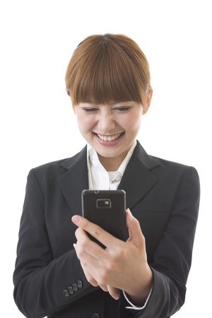 Young businesswoman to see a smartphoneの写真素材