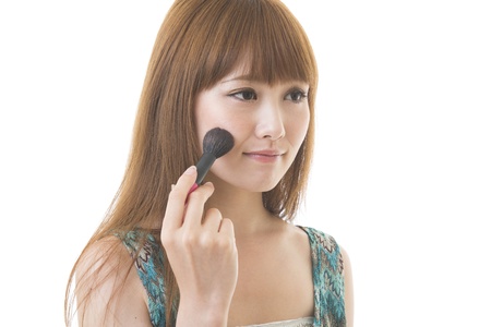 The young woman who makes upの写真素材