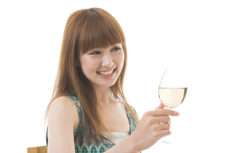 The young woman who drinks wineの写真素材