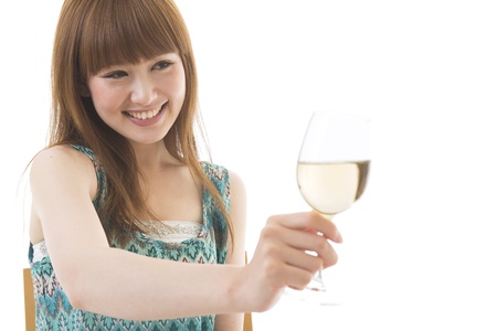 The young woman who drinks wineの写真素材